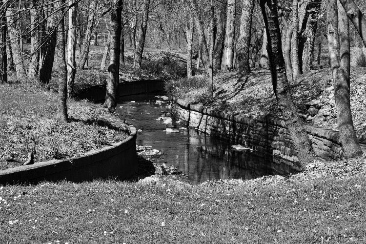 Doan Brook, as it winds through Rockefeller Park, is constrained by stone walls funded by the WPA.